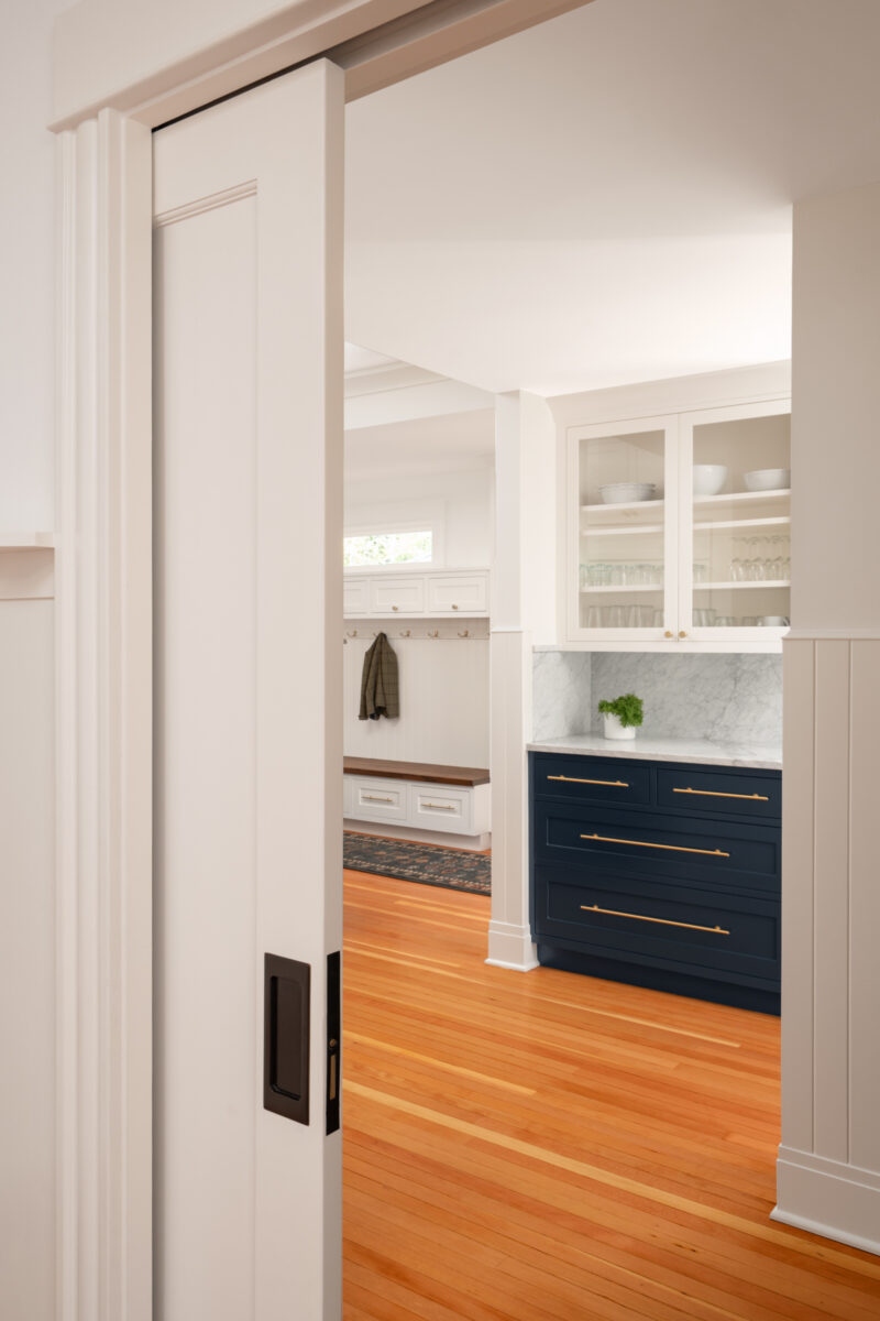Pocket door opening from the Capitol Hill kitchen to the entry and mudroom