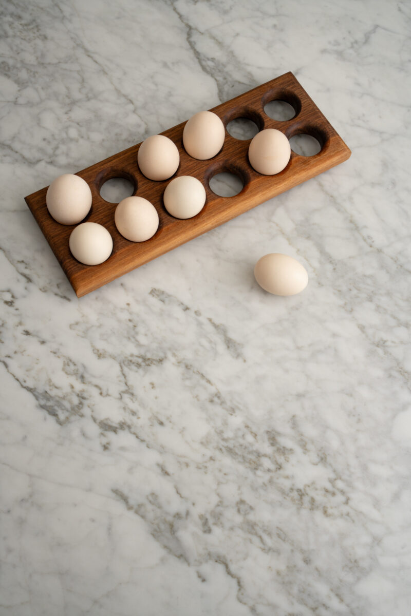 Wooden egg holder on a Carrara marble countertop in a Capitol Hill kitchen