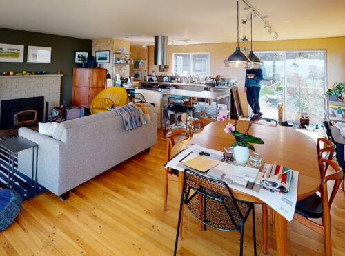 Before photo of the North Beach living and dining area with original fir floors