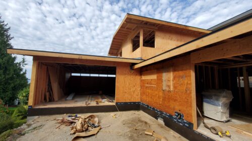Construction photo of the North Beach addition sheathed in plywood before siding