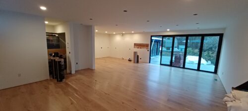 Construction photo of the North Beach main floor with new white oak flooring installed